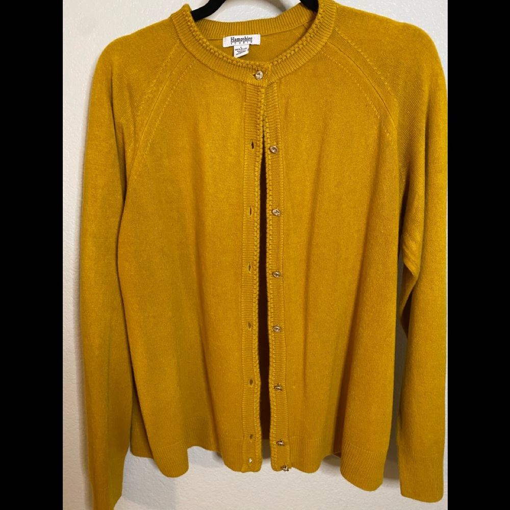 Mustard colored cardigan with jewels for buttons.